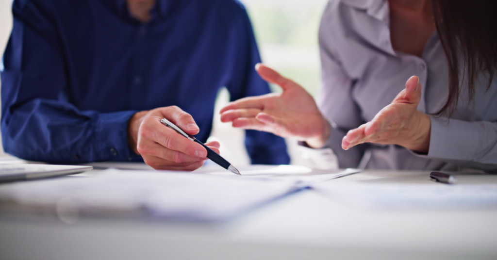 two people reviewing an rfp in an office