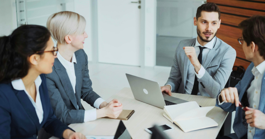 A business meeting reviewing an emergency action plan template