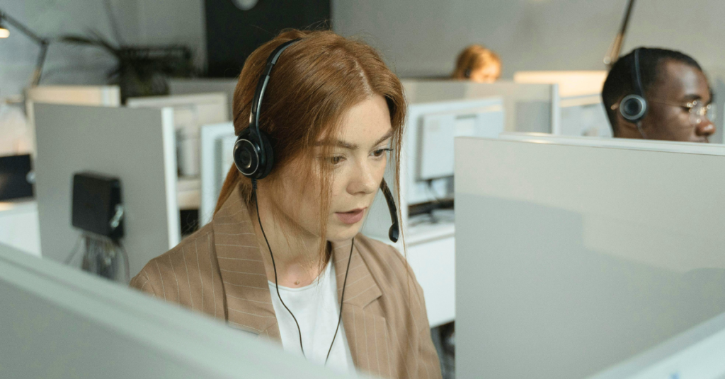 Corporate employees working in cubicles